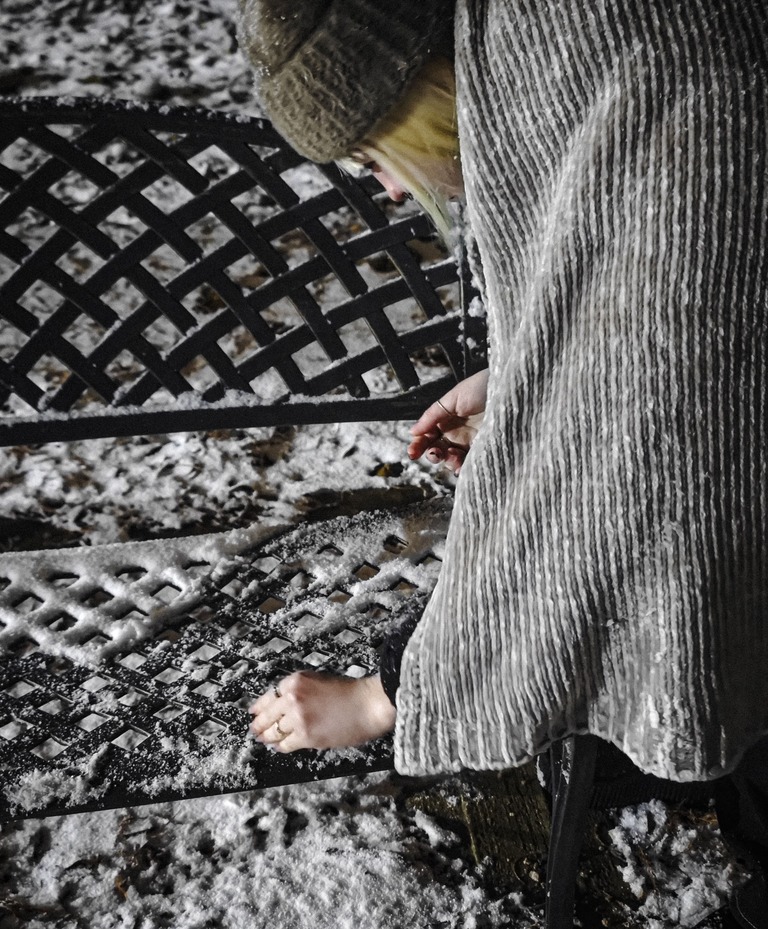 Photography - Young Child Leaning Over Snow-Covered Bench